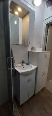 a bathroom with a sink and a mirror at Apartment BeoSun in Belgrade