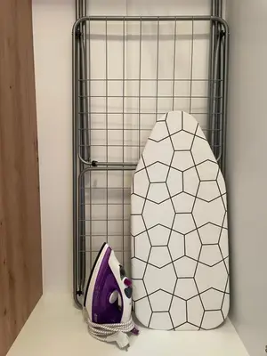 a metal cage with a stuffed animal in a room at Apartman Marija in Zvezdara