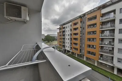 a balcony with a bench on a building at A blok - One bedroom apartment in Belgrade