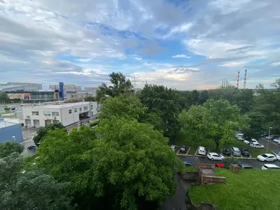 a view of a city with cars parked in a parking lot at Novi Beograd Dr.Agostina Neta in Novi Beograd