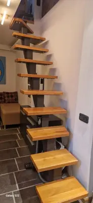 a set of wooden stairs in a room at Micro in Belgrade