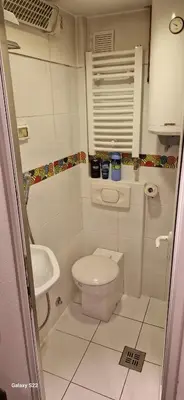 a small bathroom with a toilet and a sink at Micro in Belgrade