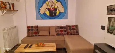 a living room with a couch and a table at Micro in Belgrade