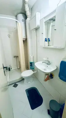 a small bathroom with a sink and a toilet at Apartman Moon in Belgrade