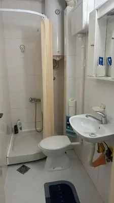 a bathroom with a sink and a toilet and a shower at Apartman Moon in Belgrade