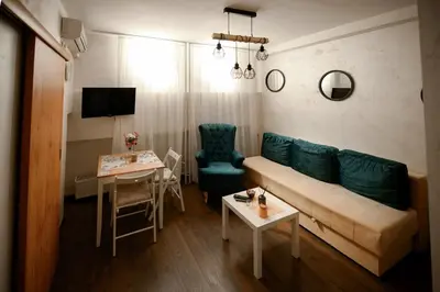 a living room with a couch and a table at Arena Belgrade in Novi Beograd