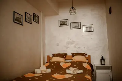 a bedroom with a bed with towels on it at Arena Belgrade in Novi Beograd