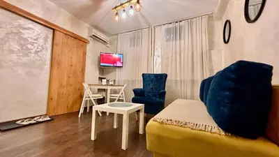 a living room with a couch and a table at Arena Belgrade in Novi Beograd