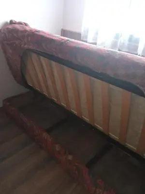 a couch sitting in the corner of a room at Marmelo in Belgrade