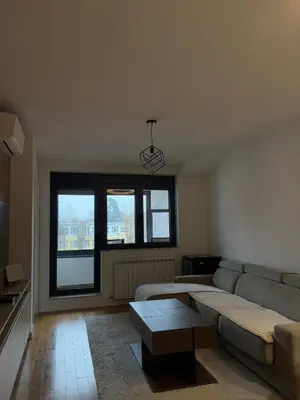 a living room with a couch and a coffee table at Apartment SIA in Voždovac