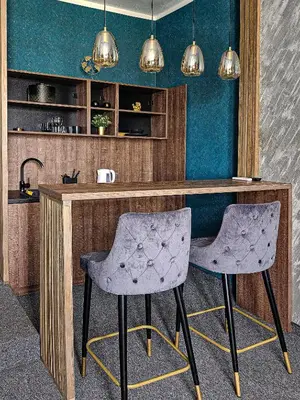 two chairs sitting at a bar in a room at MOOW Belgrade Waterfront View Apartments in Belgrade