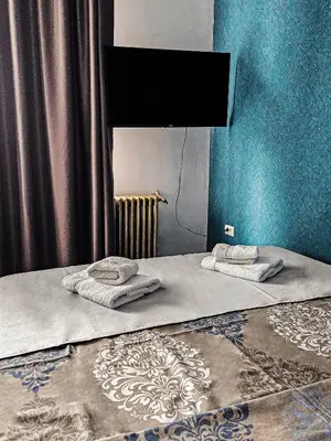 two beds with towels on them in a bedroom at MOOW Belgrade Waterfront View Apartments in Belgrade