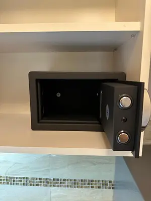 a black speaker sitting on a shelf in a room at Fortuna Lux in Zvezdara