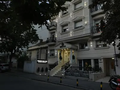 a large white building with stairs in front of it at Fortuna Lux in Zvezdara
