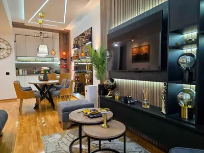 a living room with a couch and a table at Oaza apartmani in Arandjelovac