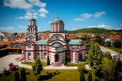 a large building with a tower on top of it at Oaza apartmani in Arandjelovac