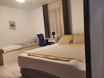 a bedroom with two beds and a mirror at \ua564 Comfy Home \ua564 - Make yourself at home in Belgrade