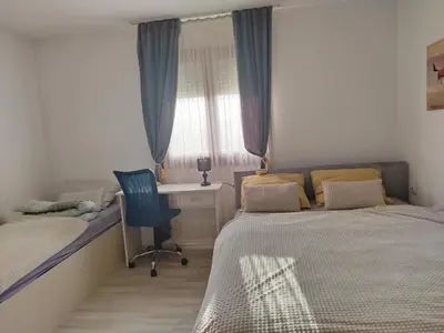 a bedroom with two beds and a desk and a chair at \ua564 Comfy Home \ua564 - Make yourself at home in Belgrade