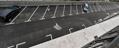 a car parked on top of a parking lot at Porto lux in Arandjelovac