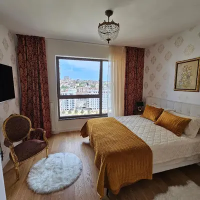 a bedroom with a bed and a large window at Belgrade Waterfront 1409 in Belgrade