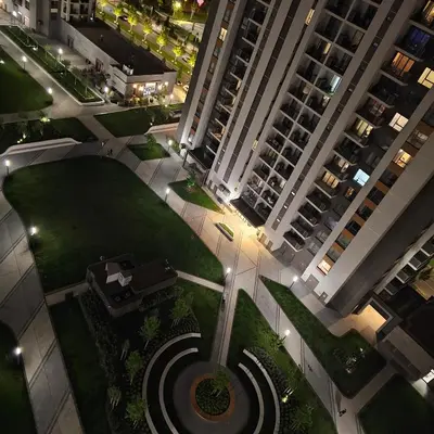 an aerial view of a large apartment complex at night at Belgrade Waterfront 1409 in Belgrade