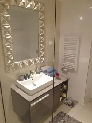 a bathroom with a sink and a mirror at Belgrade Waterfront 1409 in Belgrade