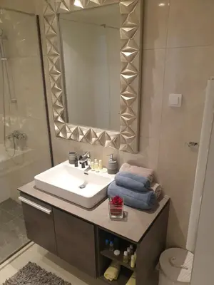 a bathroom with a sink and a mirror at Belgrade Waterfront 1409 in Belgrade