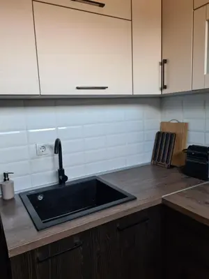 a kitchen with a sink and a counter top at Friend LUX Apartman Beograd in Belgrade