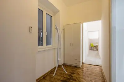 a hallway with a room with a door and a floor at Hedonist-Belgrade Central Nest in Belgrade