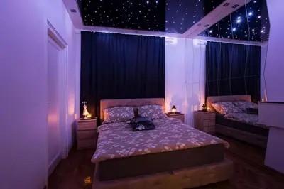a bedroom with two beds with stars on the wall at Hedonist-Belgrade Central Nest in Belgrade