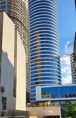a tall building with many windows in a city at Quiet place near the city center in Sajmište