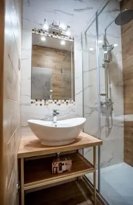 a bathroom with a sink and a shower at Apartman Provance in Batajnica