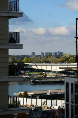 a view of a river with a bridge and buildings at inJoy in Belgrade