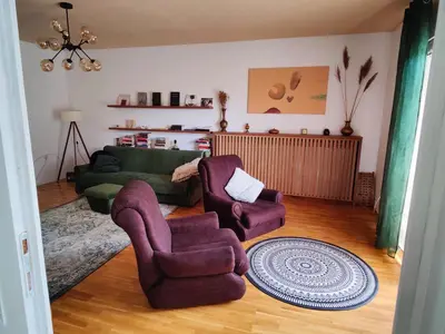 a living room with two chairs and a couch at Hedonists Paradise in Omoljica