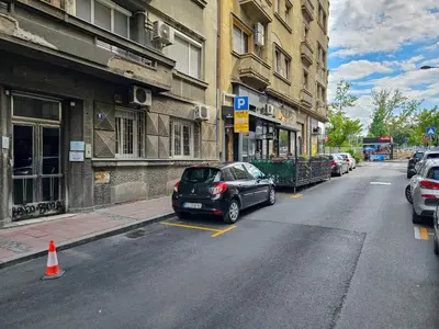 a car parked in a parking lot on a city street at HostGost Selected Suites – Parliament in Belgrade