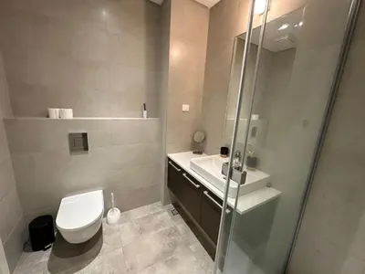 a bathroom with a toilet and a sink and a shower at Queen BW in Sajmište