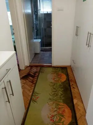 a bathroom with a shower and a rug on the floor at Martin in Belgrade