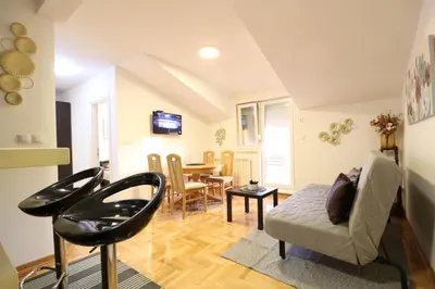 a living room with a couch and a table at Flat 23 in Belgrade