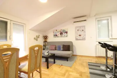 a living room with a couch and a table at Flat 23 in Belgrade