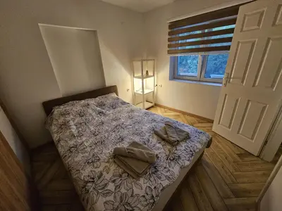 a bedroom with a bed with two pillows on it at Apartment Pegy in Novi Grad