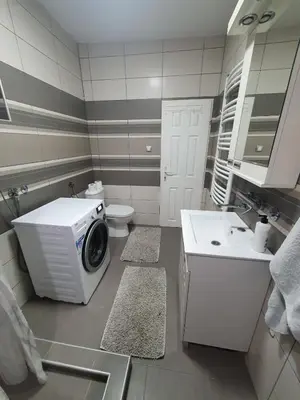 a bathroom with a washing machine and a sink at Apartment Pegy in Novi Grad