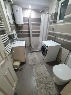 a bathroom with a toilet and a washing machine at Apartment Pegy in Novi Grad