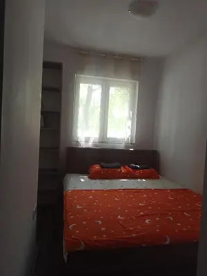 a small bedroom with a bed with a window at Studio 43 in Belgrade