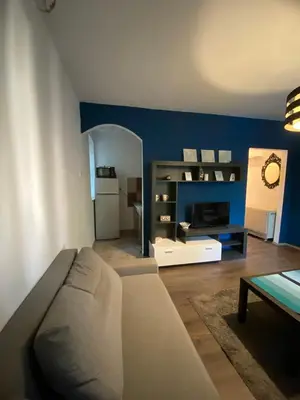 a living room with a couch and a table at Studio 43 in Belgrade
