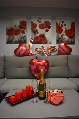 a table with two glasses and a bottle of wine at Apartman Tara in Belgrade