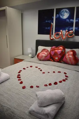 a bed with a heart made out of love on it at Apartman Tara in Belgrade