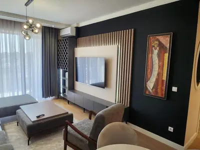 a living room with a couch and a table at BW VERDE LUX in Sajmište