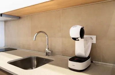 a kitchen sink with a white and black hair dryer at BW VERDE DREAM in Sajmište