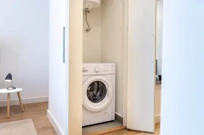 a laundry room with a washer and dryer at BW VERDE DREAM in Sajmište