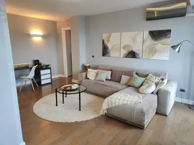 a living room with a couch and a table at Relax in Belgrade